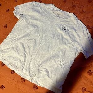 Woman’s grey Reebok shirt